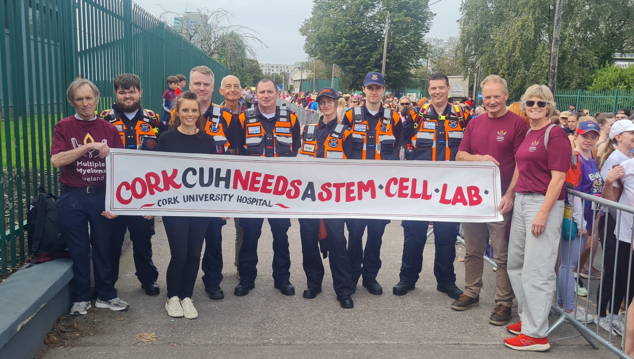 Community supporters holding a Cork University Hospital stem cell campaign banner